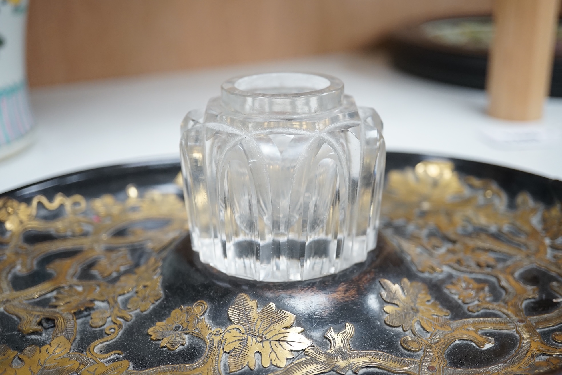 A Victorian ebonised and brass overlaid inkstand with cut glass ink well, 27cm wide. Condition - poor